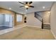 Spacious living room with access to kitchen, tile flooring, carpet flooring, recessed lights and windows at 11063 Mount George St, Las Vegas, NV 89179