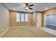 Inviting living area with neutral tones, recessed lighting, carpet flooring and multiple windows at 11063 Mount George St, Las Vegas, NV 89179