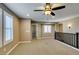 View of the carpeted loft featuring views of the staircase and open door at 11063 Mount George St, Las Vegas, NV 89179