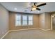 Bright carpeted loft area featuring recessed lighting and several shuttered windows at 11063 Mount George St, Las Vegas, NV 89179