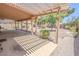Covered patio overlooking the spacious backyard, ideal for outdoor entertaining at 1174 Monogram Way, Las Vegas, NV 89123
