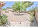 Well-maintained backyard featuring decorative rock, mature landscaping and low-water plants at 1174 Monogram Way, Las Vegas, NV 89123