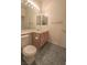 Bathroom featuring a vanity, toilet, and large mirror at 1174 Monogram Way, Las Vegas, NV 89123