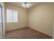 This carpeted bedroom has natural light from a window and a ceiling fan with lighting at 1174 Monogram Way, Las Vegas, NV 89123