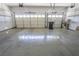 Two-car garage features a sealed concrete floor, lots of storage space, and two automatic garage doors at 1174 Monogram Way, Las Vegas, NV 89123