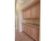 Hallway featuring built in cabinets and tile flooring at 1174 Monogram Way, Las Vegas, NV 89123