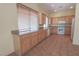 Bright kitchen featuring ample cabinets, countertop space and tile flooring at 1174 Monogram Way, Las Vegas, NV 89123