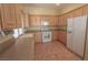 Bright kitchen featuring ample cabinets, countertop space and tile flooring at 1174 Monogram Way, Las Vegas, NV 89123