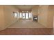 Carpeted living area features fireplace, and views of outdoor space at 1174 Monogram Way, Las Vegas, NV 89123