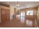 Spacious living room showcasing tile floors, ample natural light and built in entertainment center at 1174 Monogram Way, Las Vegas, NV 89123