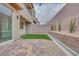 Small backyard with a strip of green grass at 11904 Glide Reflection Ave, Las Vegas, NV 89138