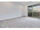 Spacious bedroom with a sliding glass door and mountain view at 11904 Glide Reflection Ave, Las Vegas, NV 89138