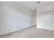 Clean bedroom showcasing a closet with sliding doors and neutral carpet flooring at 11904 Glide Reflection Ave, Las Vegas, NV 89138
