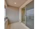 Private balcony offering a view of distant mountains, accessible through a sliding glass door at 11922 Glide Reflection Ave, Las Vegas, NV 89138
