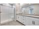 Elegant bathroom featuring a glass-enclosed shower and a double sink vanity with modern hardware at 11922 Glide Reflection Ave, Las Vegas, NV 89138