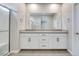 Stylish bathroom showcasing a double sink vanity with modern fixtures and a glass-enclosed shower at 11922 Glide Reflection Ave, Las Vegas, NV 89138