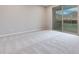 Bright bedroom with neutral carpet and sliding glass doors to a balcony with mountain views at 11922 Glide Reflection Ave, Las Vegas, NV 89138