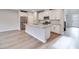 Bright, modern kitchen features stainless appliances, white cabinets, and island at 11922 Glide Reflection Ave, Las Vegas, NV 89138