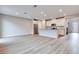 Spacious open-concept living room and kitchen with recessed lighting and laminate flooring at 11922 Glide Reflection Ave, Las Vegas, NV 89138