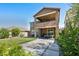 Expansive backyard with a covered patio, second story balcony and ample space for outdoor activities at 12290 Terrace Verde Ave, Las Vegas, NV 89138