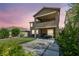 Expansive backyard with a covered patio, second story balcony and ample space for outdoor activities at 12290 Terrace Verde Ave, Las Vegas, NV 89138