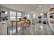 Upstairs bonus room with a large table, workstation, exercise bike, and plenty of natural light at 12290 Terrace Verde Ave, Las Vegas, NV 89138