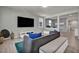 Bright and airy living room with modern furniture and decor, seamlessly flowing into the kitchen at 12290 Terrace Verde Ave, Las Vegas, NV 89138