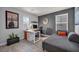 Stylish office space with modern furnishings, a comfortable daybed, and artwork, perfect for a productive work environment at 12290 Terrace Verde Ave, Las Vegas, NV 89138