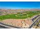 Wide aerial view of the community with parks, walking trails, and green spaces amid residential area at 129 Major Bowling Pl, Henderson, NV 89011