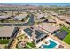 Overhead view featuring the backyard, pool, fire pit, solar panels, landscaping, and surrounding neighborhood at 129 Major Bowling Pl, Henderson, NV 89011