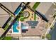 Stunning overhead view displaying the pool, fire pit, solar panels, and beautifully landscaped backyard at 129 Major Bowling Pl, Henderson, NV 89011