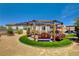 Beautiful backyard showcasing a custom swing set, artificial grass, and desert landscaping at 129 Major Bowling Pl, Henderson, NV 89011