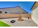 Cozy backyard featuring gravel, brick wall, and a fire pit, perfect for outdoor relaxation at 129 Major Bowling Pl, Henderson, NV 89011