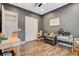 Versatile bedroom/flex space with gray walls, light colored wood flooring, and double closet at 129 Major Bowling Pl, Henderson, NV 89011