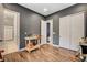 Versatile bedroom/flex space with gray walls and access to ensuite bathroom and closet at 129 Major Bowling Pl, Henderson, NV 89011