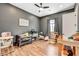 Versatile bedroom/flex space with gray walls, ceiling fan, and a variety of furnishings and decor at 129 Major Bowling Pl, Henderson, NV 89011