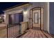 Front entrance with an iron gate, manicured landscaping, and stone walkway at 129 Major Bowling Pl, Henderson, NV 89011