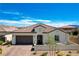 Charming single-story home featuring a tile roof, stucco exterior, and a well-maintained front yard at 129 Major Bowling Pl, Henderson, NV 89011