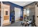 Bright home gym with weight rack, bench, weights, mirror, and view from the window at 129 Major Bowling Pl, Henderson, NV 89011