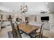 Open concept kitchen and living area features stainless steel appliances and an eat-in kitchen island at 129 Major Bowling Pl, Henderson, NV 89011