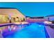 Beautiful backyard pool with spa, water features, and outdoor lounge area for relaxation at 129 Major Bowling Pl, Henderson, NV 89011