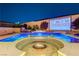 Backyard pool area with a fire pit, hot tub, and outdoor movie screen for entertaining at 129 Major Bowling Pl, Henderson, NV 89011