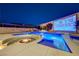 Backyard featuring a pool, fire pit, hot tub, and outdoor screen for ultimate entertainment at 129 Major Bowling Pl, Henderson, NV 89011
