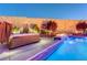 Backyard pool and spa with waterfall and fire features, perfect for evening relaxation at 129 Major Bowling Pl, Henderson, NV 89011