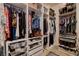Organized walk-in closet with custom shelving, hanging rods, drawers, and ample storage at 129 Major Bowling Pl, Henderson, NV 89011