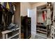 Well-organized walk-in closet with shelving, hanging space, and a hidden safe at 129 Major Bowling Pl, Henderson, NV 89011