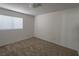 Simple bedroom boasts neutral carpeting, a bright window, and versatile layout at 1349 Goldenglow Rd, Las Vegas, NV 89108
