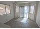 Bright dining area featuring large windows, sliding glass doors, and modern lighting fixture at 1349 Goldenglow Rd, Las Vegas, NV 89108
