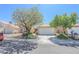 Charming single-story home with a two-car garage and mature landscaping at 1349 Goldenglow Rd, Las Vegas, NV 89108