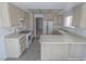 Bright kitchen features tile floors, wood cabinets, and white appliances at 1349 Goldenglow Rd, Las Vegas, NV 89108